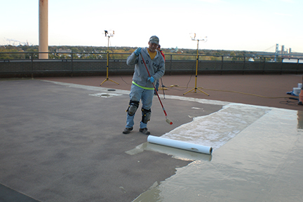 GLCR Edison Deck Restoration appying liquid roofing solution toledo downtown