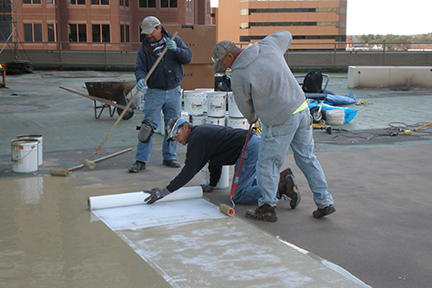 GLCR Edison Deck Restoration crew appying liquid roofing solution toledo downtown